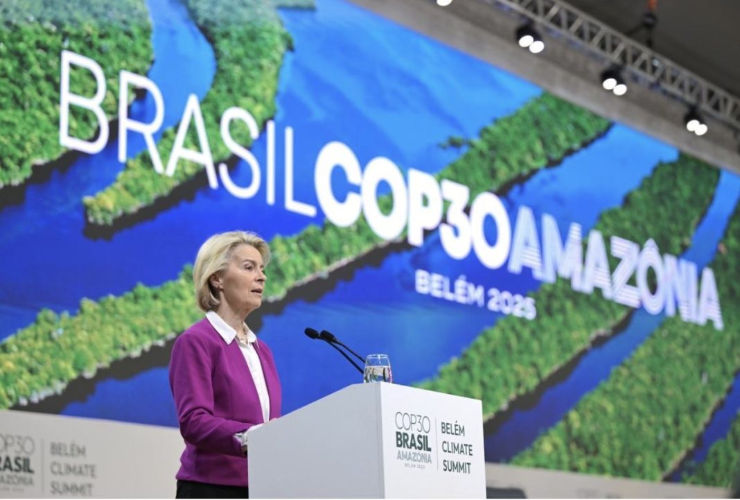 Woman in a purple blazer speaks at a podium during the COP30 Brazil Amazon Summit in Belém, 2025.