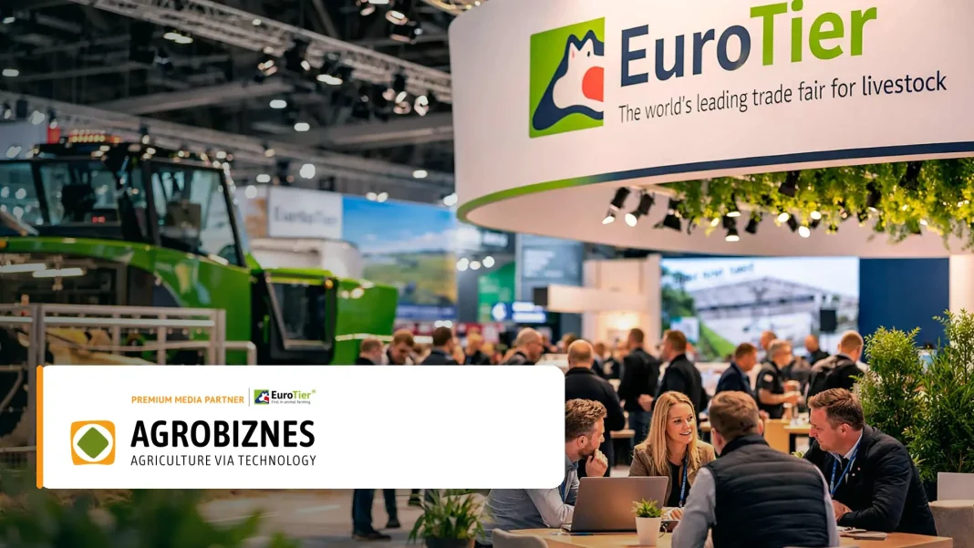 EuroTier trade fair booth with AGROBIZNES sign; attendees network and discuss at a busy agriculture expo.